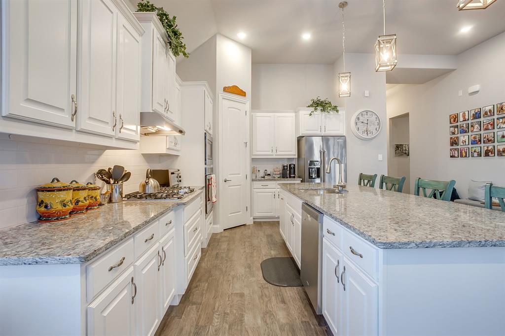 11829 Kynborrow Road Fort Worth, TX 76052 - Photo 10 of 39 a large kitchen with granite countertop a lot of counter space and wooden floor