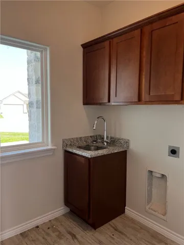a stove top oven sitting inside of a kitchen