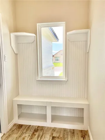 a bathroom with a bathtub and a window