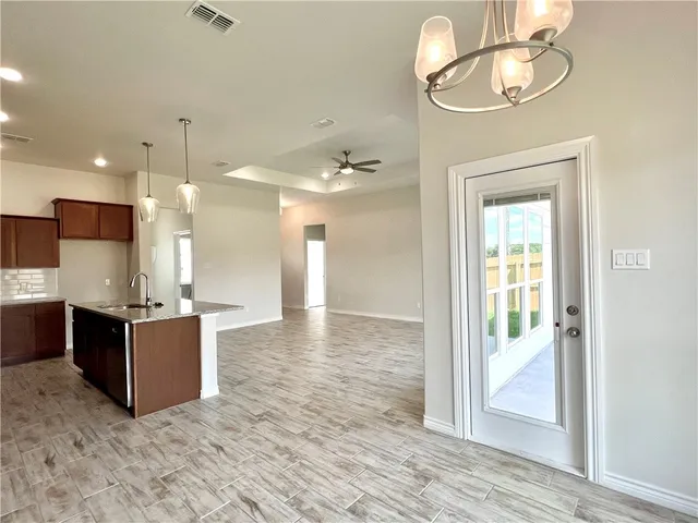 a view of a kitchen and dining room
