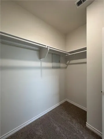 a view of an empty walk in closet