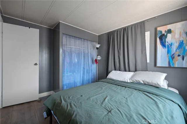 a bedroom with a large bed and a closet