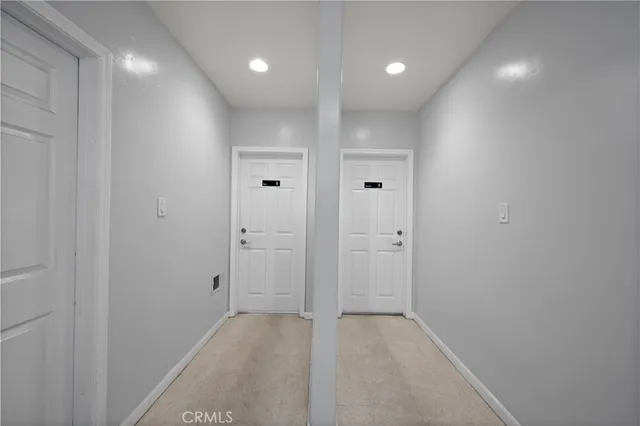 a kitchen with a sink cabinets and stainless steel appliances