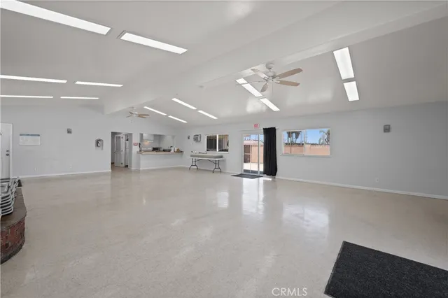 a view of a livingroom with furniture and a flat screen tv