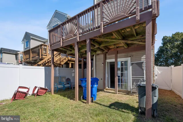a view of a house with a porch and furniture