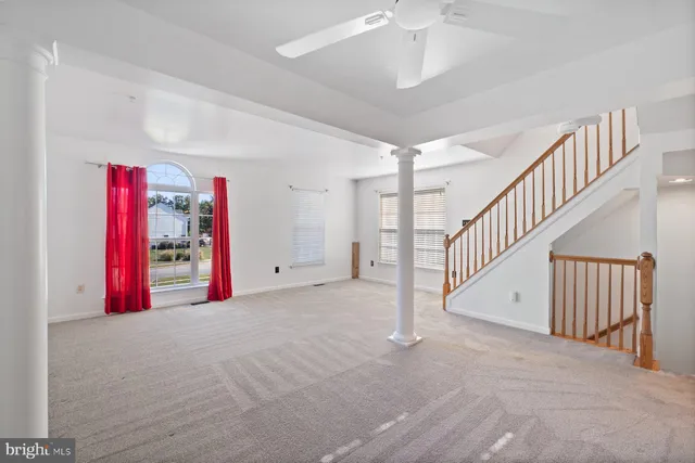 a view of an empty room with windows