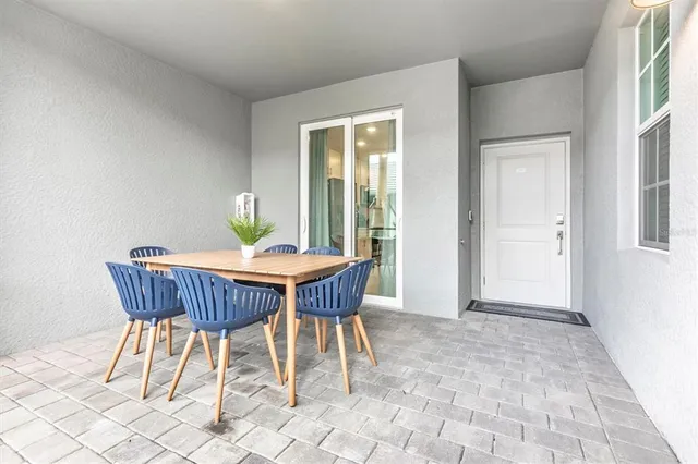 a view of a dining room with furniture window and outside view