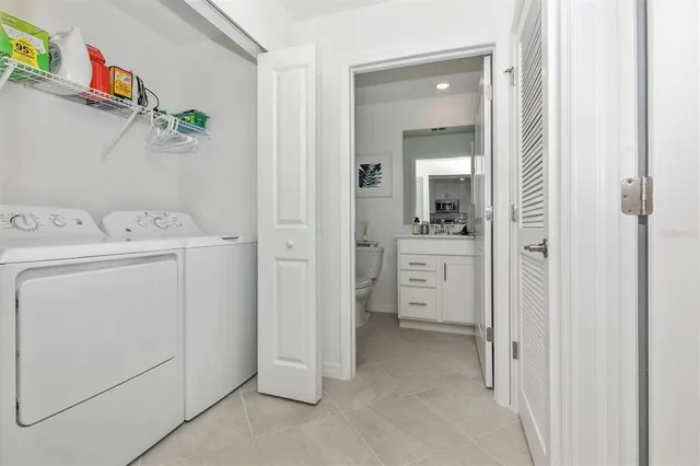 a view of a patio with a table and chairs