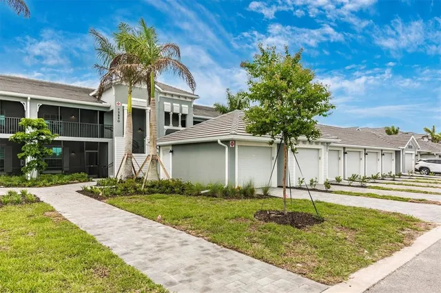 a dining room with lots of wooden furniture and a chandelier