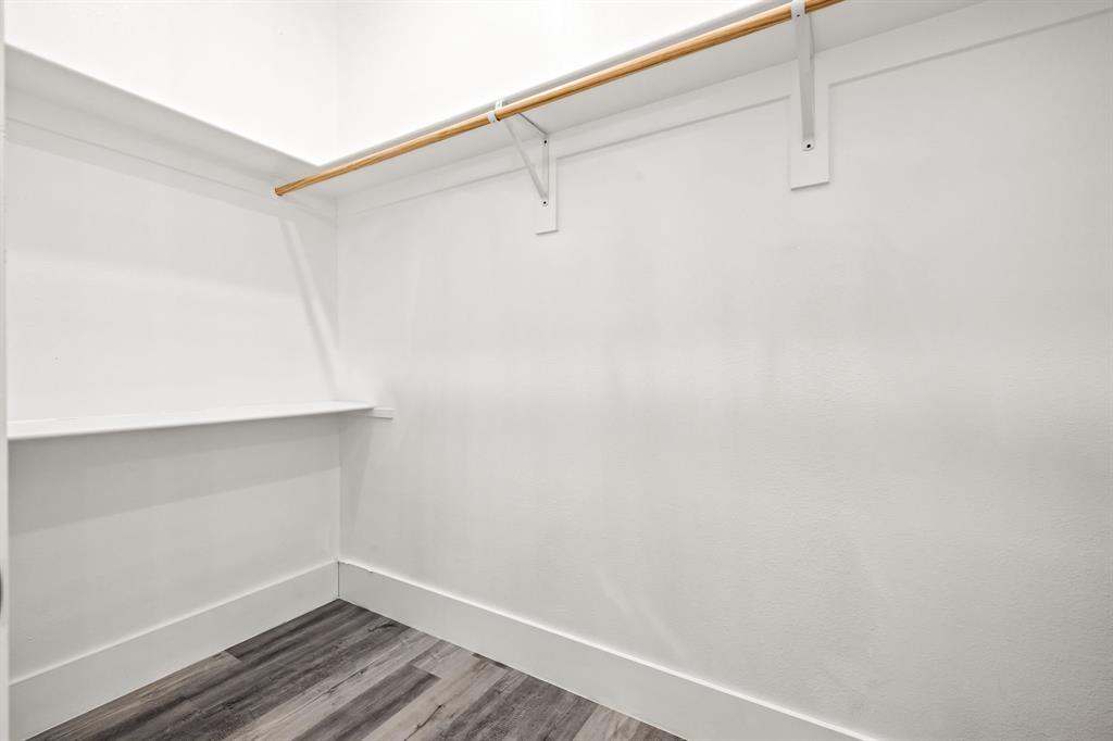 9020 Creek Run Road Fort Worth, TX 76120 - Photo 18 of 37 a view of a room with racks on the wall