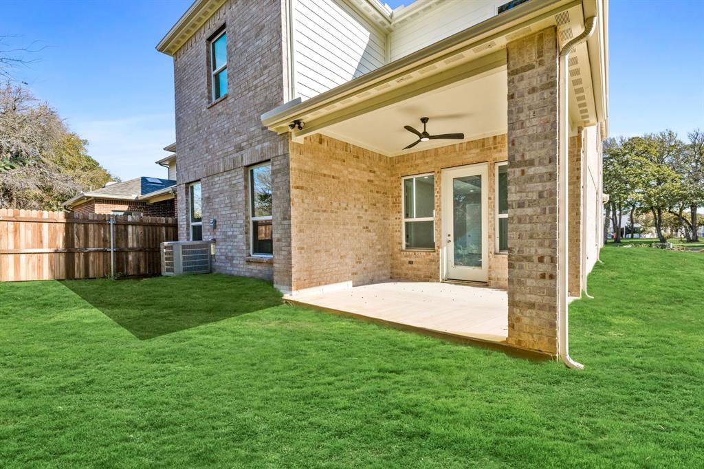 9020 Creek Run Road Fort Worth, TX 76120 - Photo 29 of 37 a view of a house with a yard