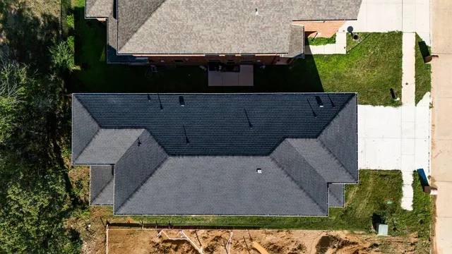a aerial view of a house with a yard
