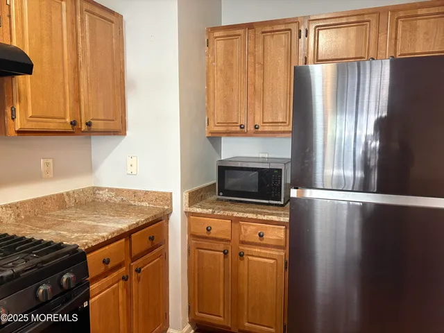 a view of balcony with wooden floor