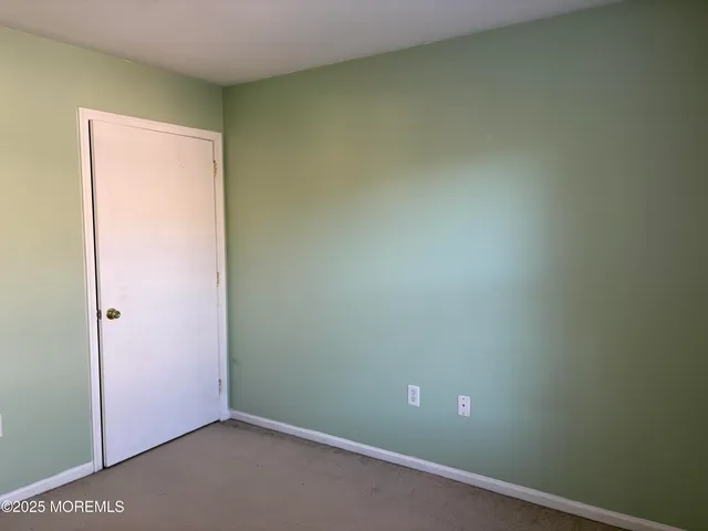 a room with a bed and gym equipment