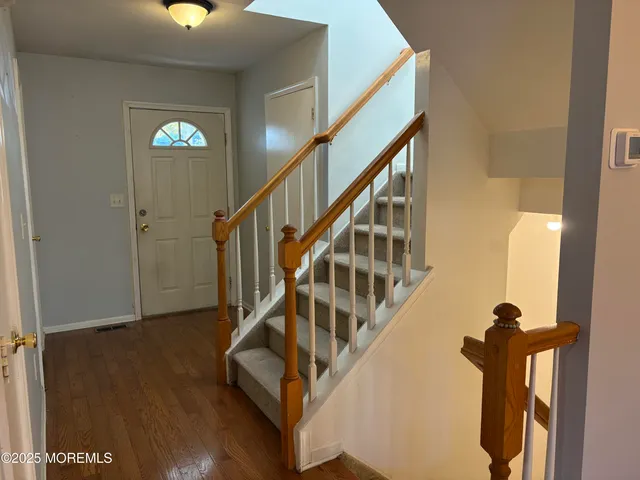 a bathroom with a toilet a sink and a mirror