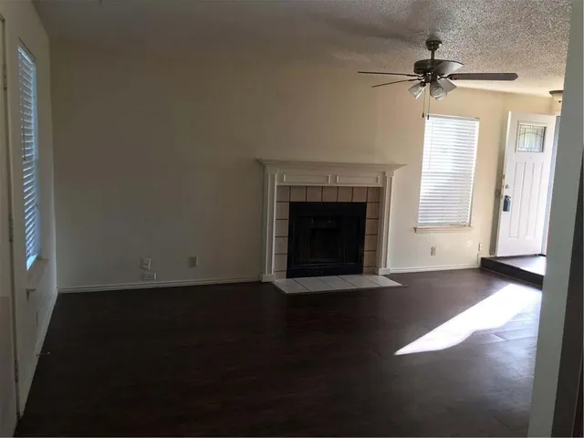 a view of a kitchen with a sink and cabinets