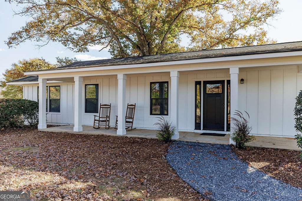 1410 Old Bishop Road Bishop, GA 30621 - Photo 2 of 73 a front view of a house with garden