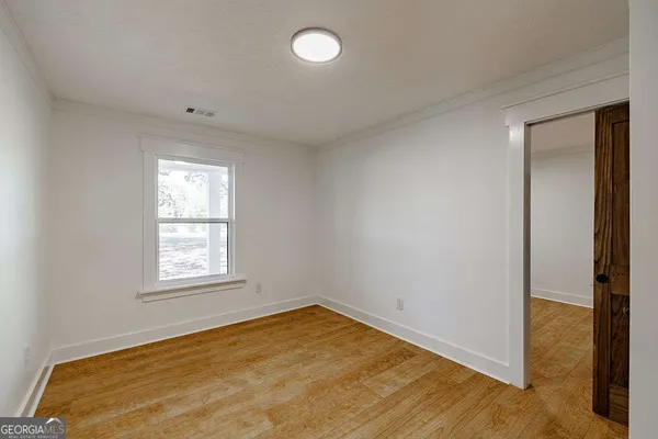 a bathroom with a shower and a sink