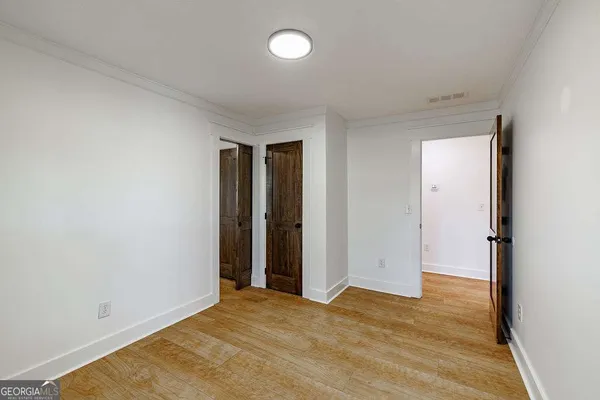 a view of an empty walk in closet