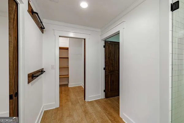 a view of a yard in front of a house with large tree