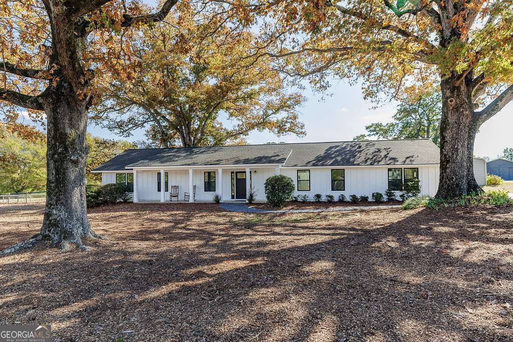 1410 Old Bishop Road Bishop, GA 30621 - Photo 37 of 73 a view of a yard in front of a house with large tree