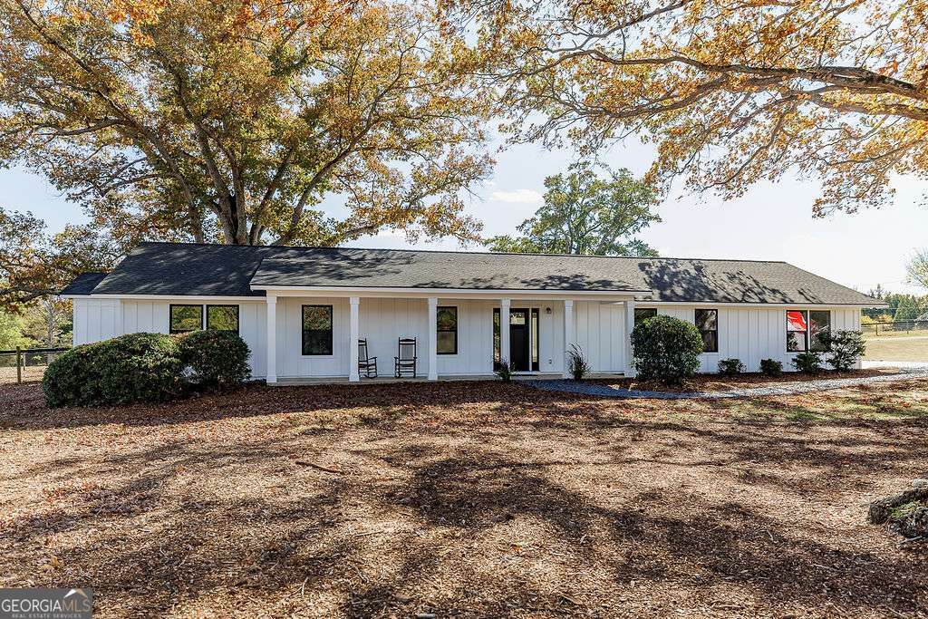 1410 Old Bishop Road Bishop, GA 30621 - Photo 38 of 73 a view of a house with a large tree in front of it