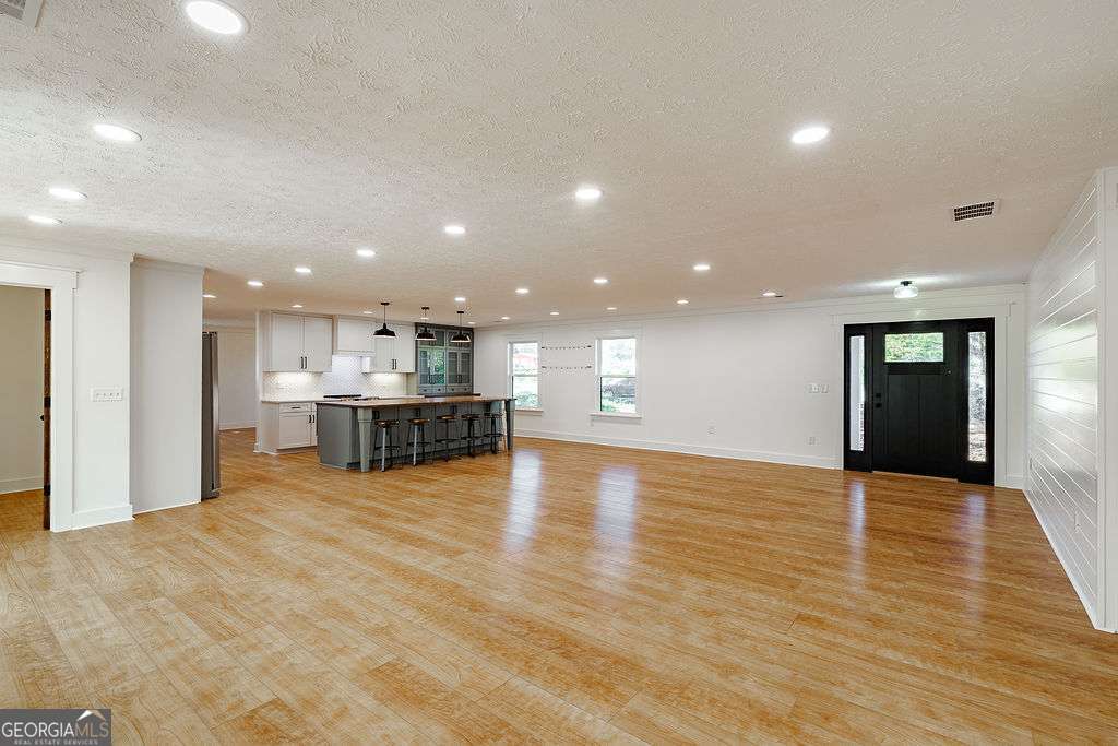1410 Old Bishop Road Bishop, GA 30621 - Photo 7 of 73 a view of an empty room with kitchen and window