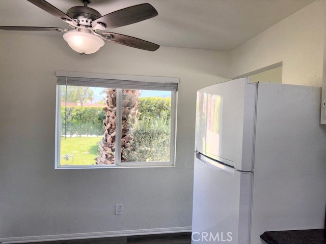 73740 Santa Rosa Way, Unit E Palm Desert, CA 92260 - Photo 12 of 15 a view of kitchen with window cabinet and refrigerator