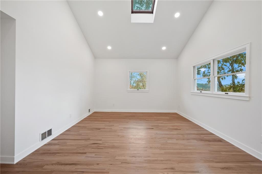 107 Marlboro Road Pittsburgh, PA 15238 - Photo 27 of 45 an empty room with wooden floor and windows