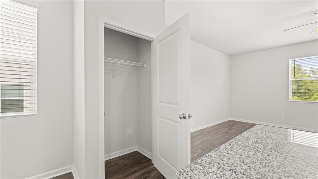 11923 Aukerman Way Hampton, GA 30228 - Photo 21 of 26 a view of hallway with window and hardwood floor