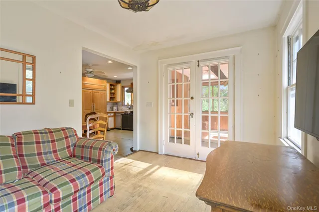 a bedroom with furniture and a window