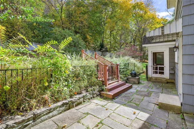a view of house with backyard