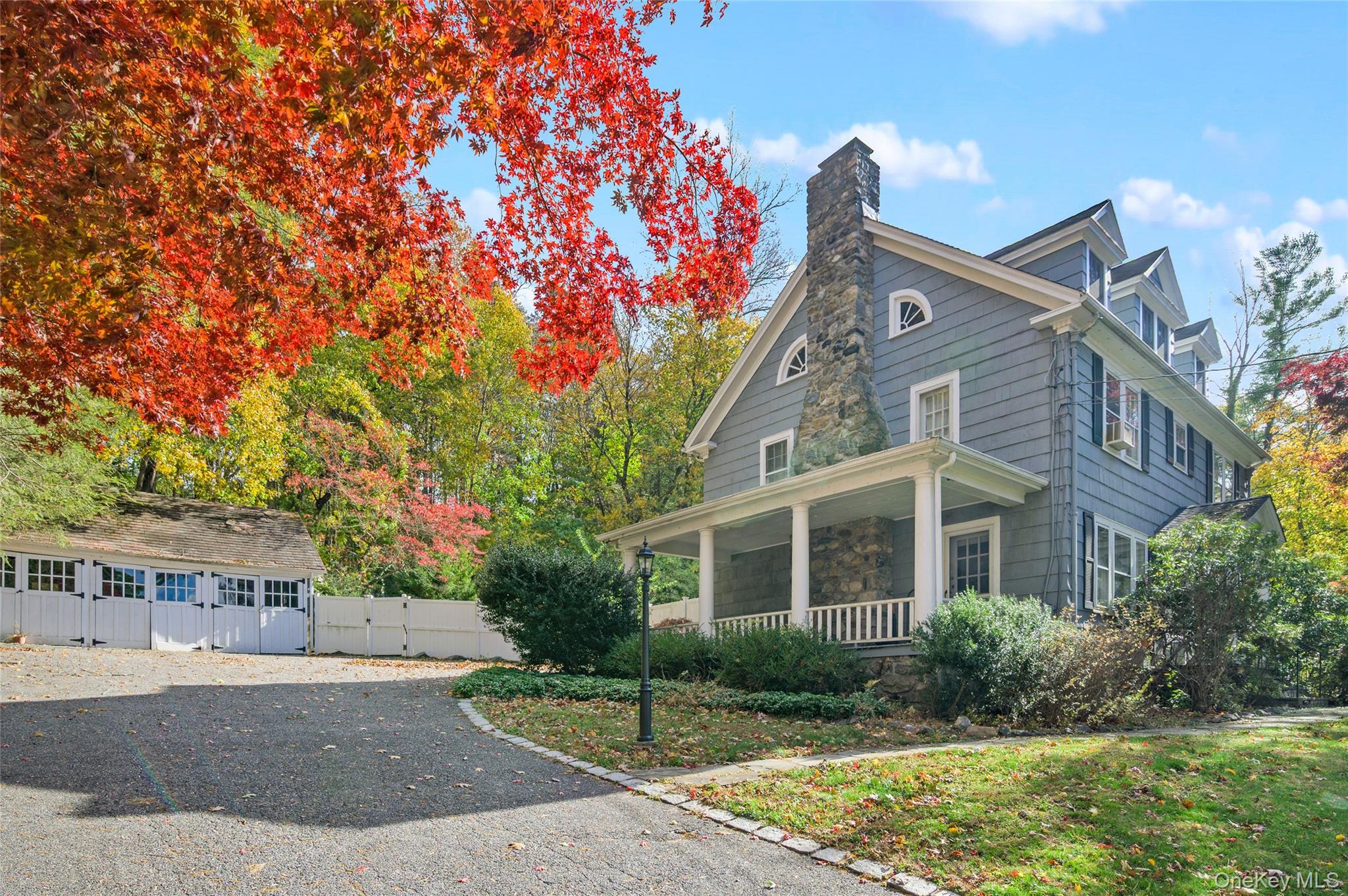 48 Mustato Road Katonah, NY 10536 - Photo 3 of 30 a front view of a house with a garden