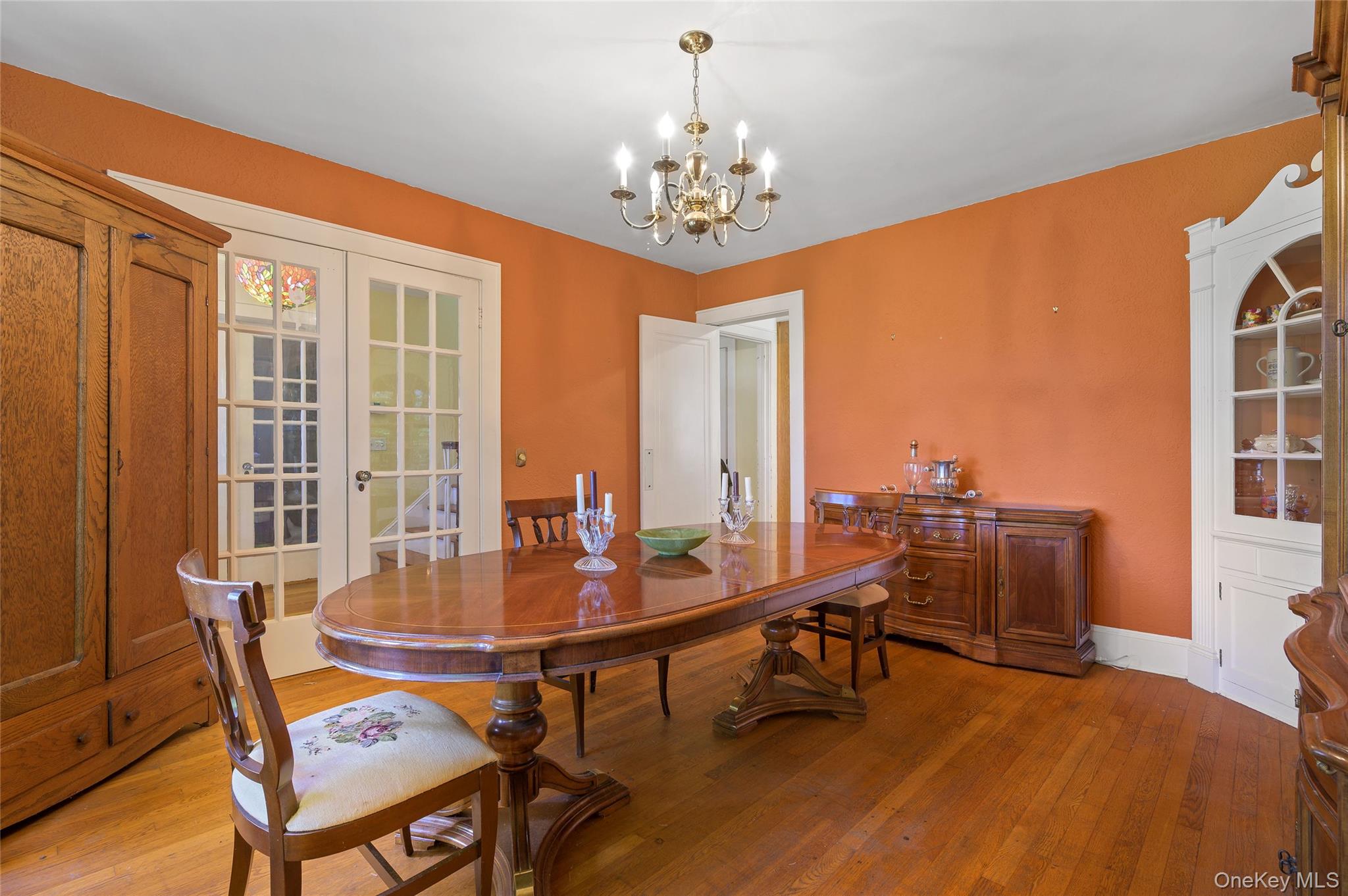 48 Mustato Road Katonah, NY 10536 - Photo 10 of 30 a dining room with furniture a chandelier and wooden floor