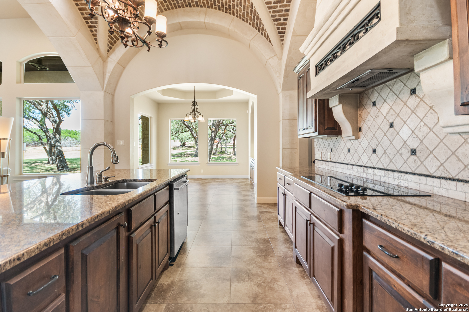 68 Brook Ridge Fair Oaks Ranch, TX 78015 - Photo 11 of 69 a kitchen with stainless steel appliances granite countertop a stove and a sink