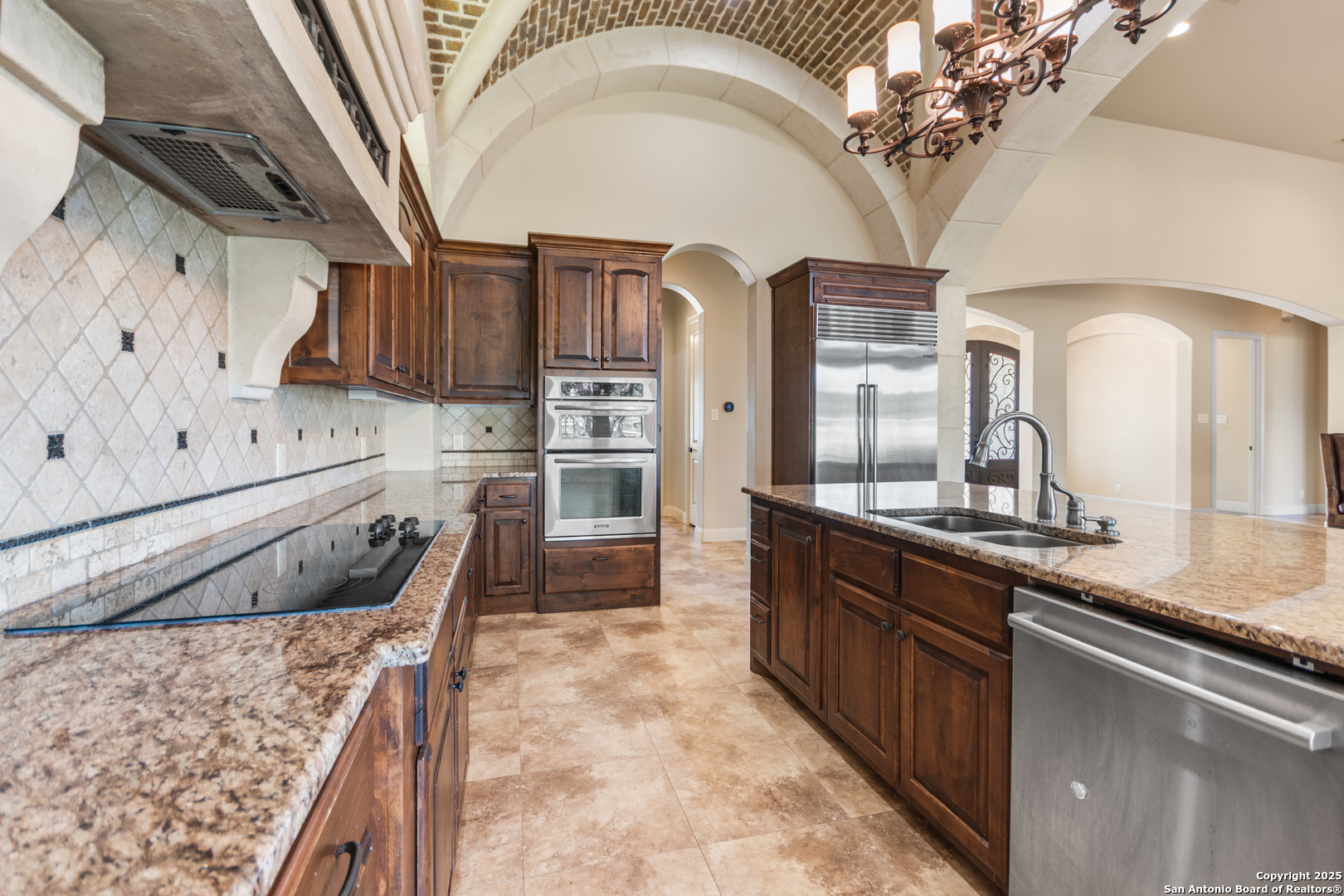 68 Brook Ridge Fair Oaks Ranch, TX 78015 - Photo 16 of 69 a kitchen with stainless steel appliances granite countertop a stove a sink and a refrigerator