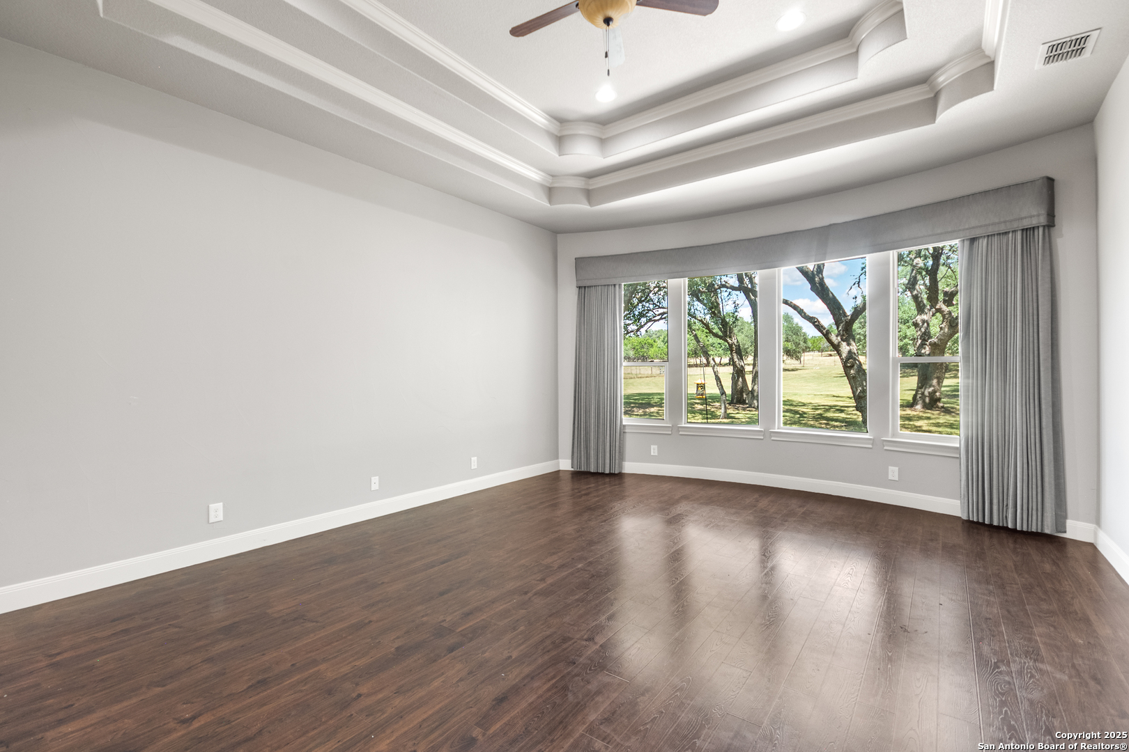 68 Brook Ridge Fair Oaks Ranch, TX 78015 - Photo 24 of 69 an empty room with wooden floor and windows