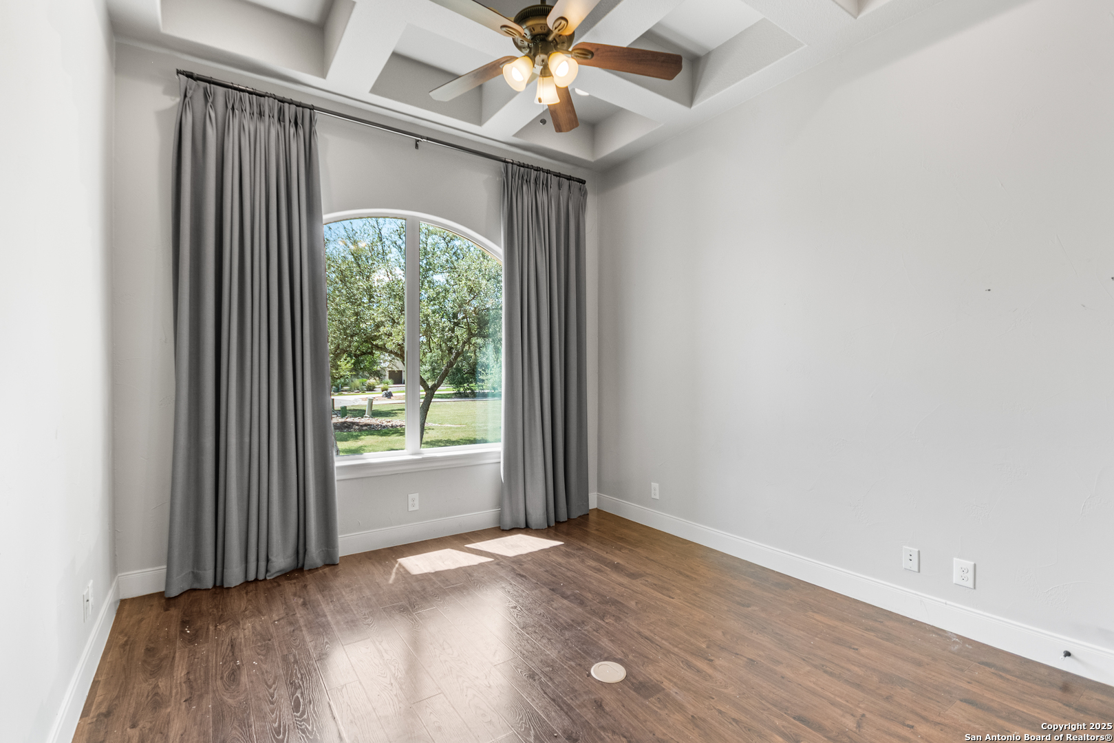 68 Brook Ridge Fair Oaks Ranch, TX 78015 - Photo 25 of 69 an empty room with wooden floor fan and windows