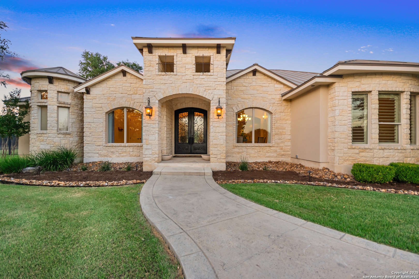 68 Brook Ridge Fair Oaks Ranch, TX 78015 - Photo 4 of 69 a front view of a house with a garden and plants