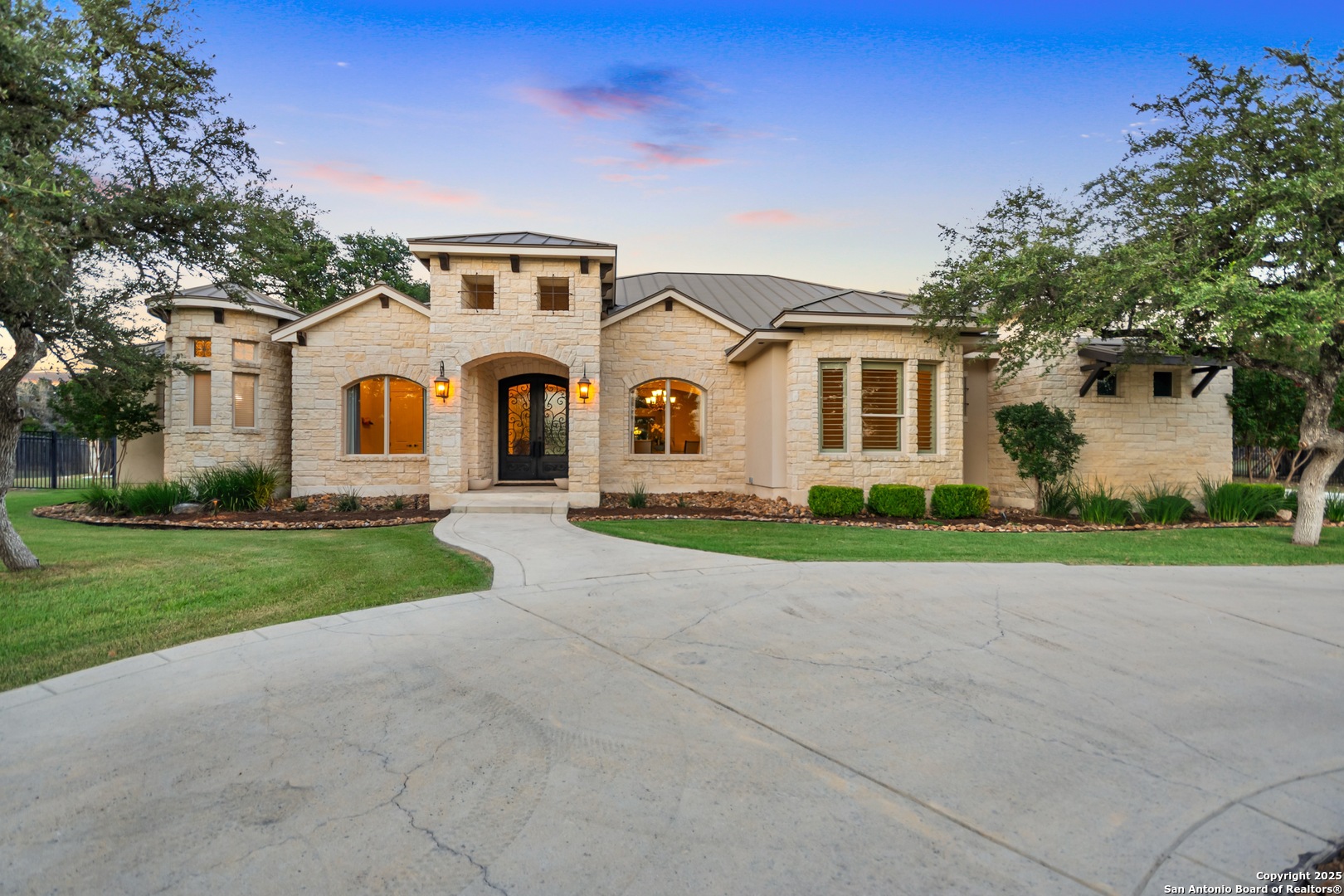 68 Brook Ridge Fair Oaks Ranch, TX 78015 - Photo 53 of 69 a front view of a house with a yard