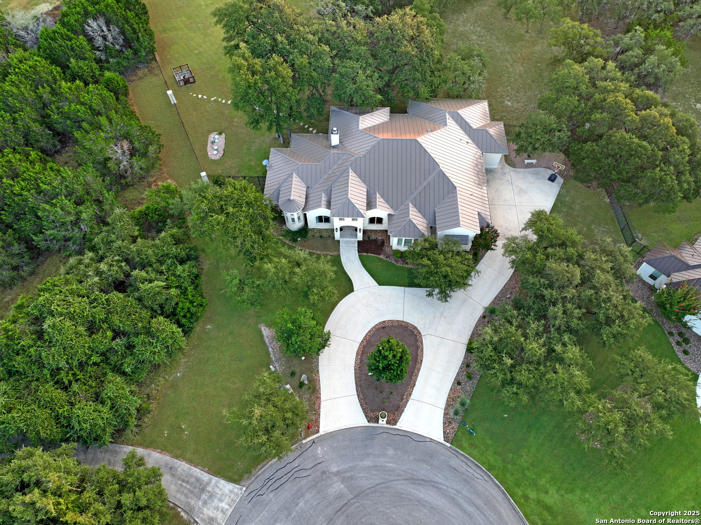 68 Brook Ridge Fair Oaks Ranch, TX 78015 - Photo 56 of 69 an aerial view of a house with garden space and street view