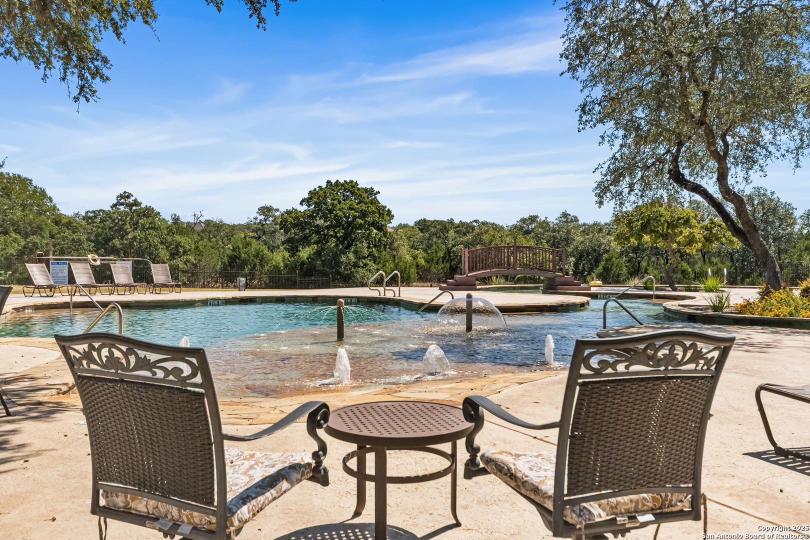 68 Brook Ridge Fair Oaks Ranch, TX 78015 - Photo 64 of 69 a view of a swimming pool with a patio and fire pit