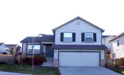 10963 Osprey Court Parker, CO 80134 - Photo 1 of 1 a view of a house with a yard and large tree