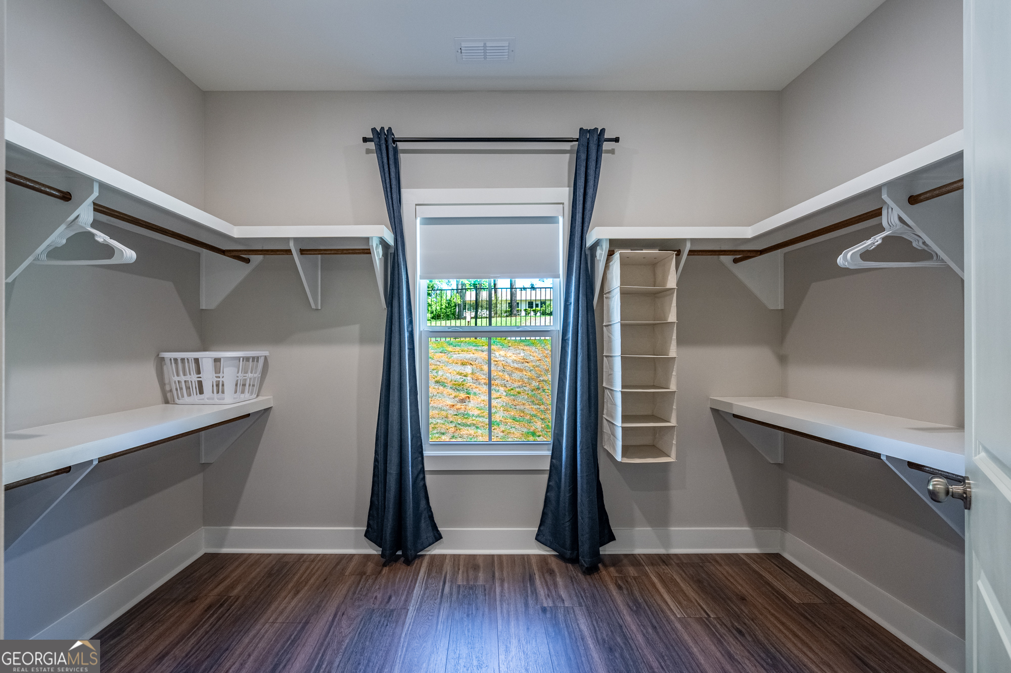 143 Old Alabama Road Southeast Emerson, GA 30137 - Photo 20 of 48 a view of walk in closet with wooden floor and fan