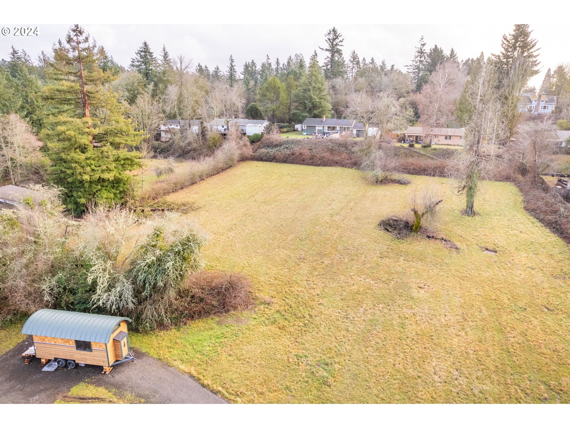 6140 South Canby Street Portland, OR 97219 - Photo 4 of 8 a view of a swimming pool with an outdoor space and seating area