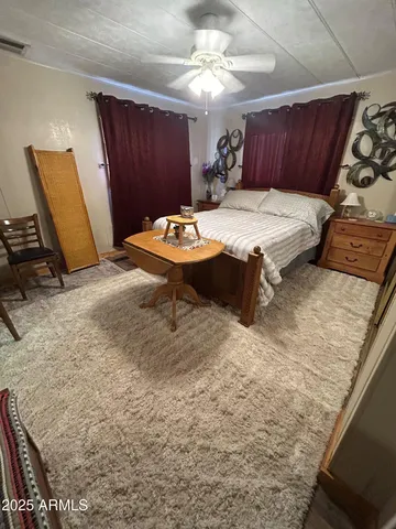 a room with wooden cabinets and sink