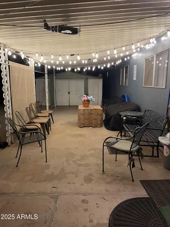 a view of a chairs and table in a patio