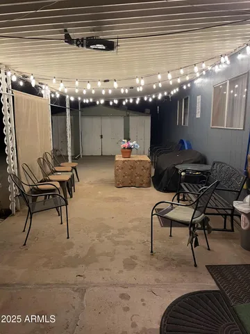 a view of a chairs and table in a patio