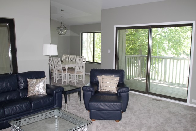 260 Timber Ridge Lane, Unit A Lake Barrington, IL 60010 - Photo 4 of 20 a living room with furniture and a large window