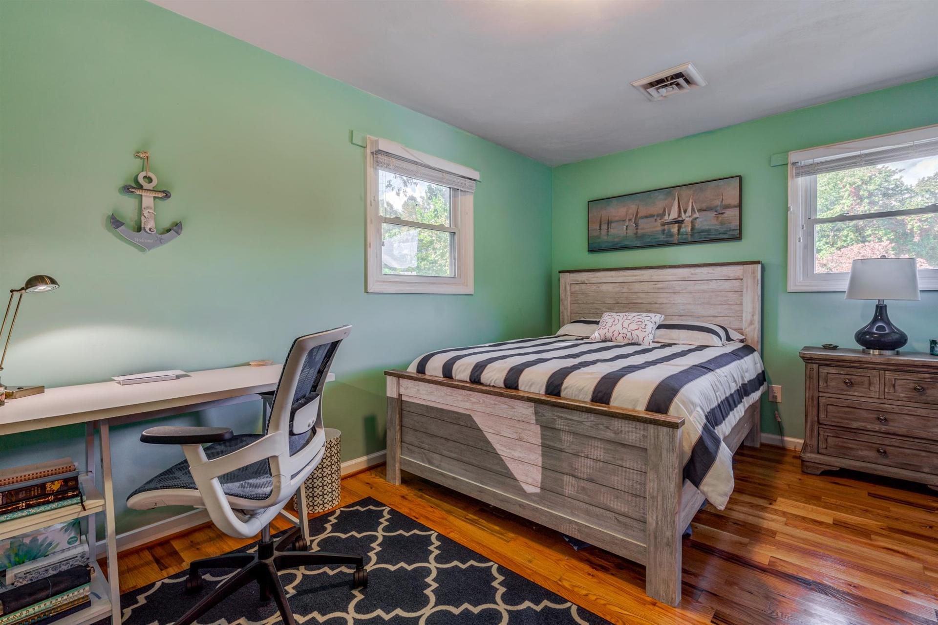 411 Monte Vista Road Union Hall, VA 24176 - Photo 18 of 45 a bedroom with a bed and a table